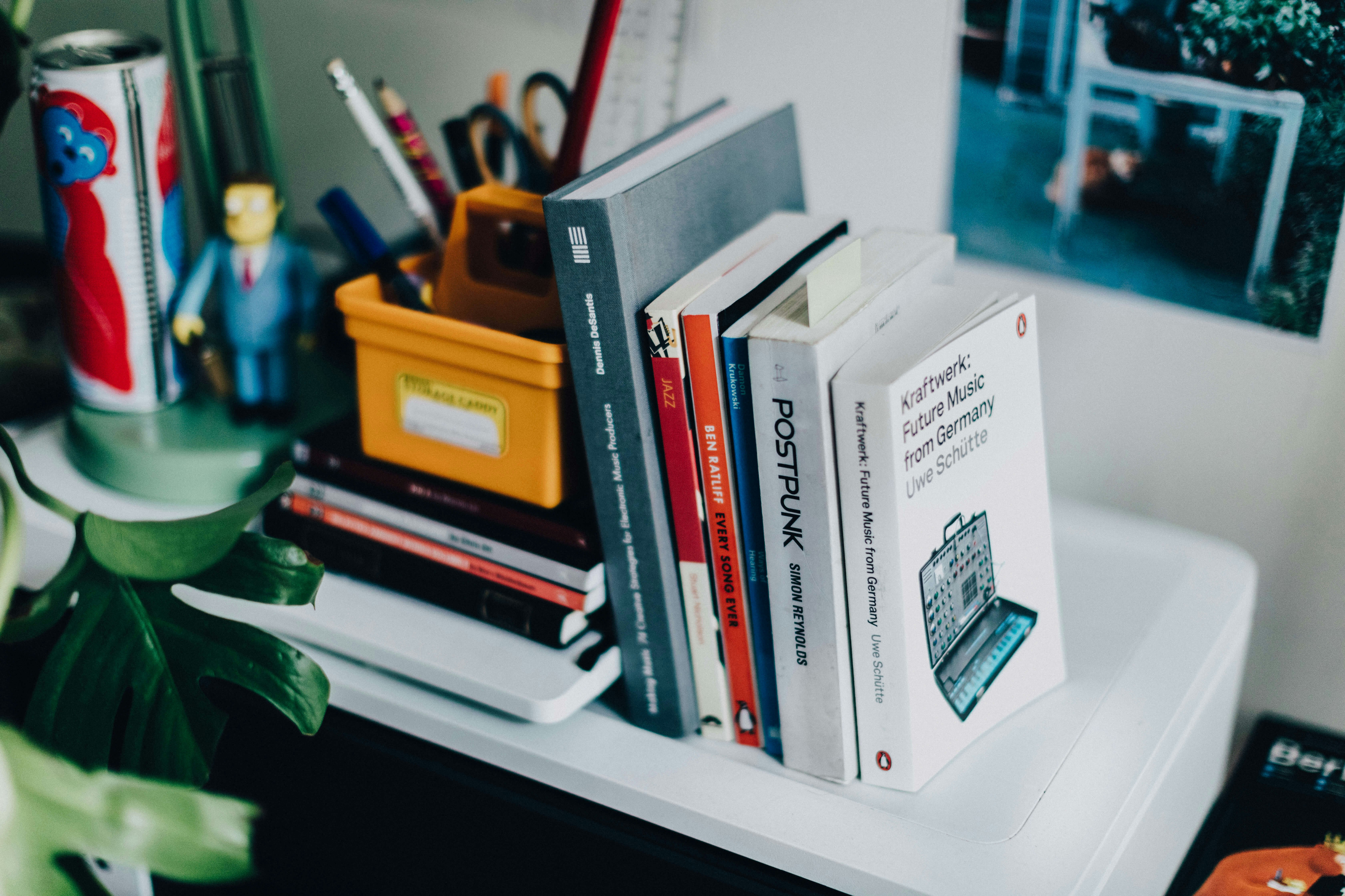 white and black labeled book on white shelf